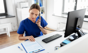 woman reading updates on 2026 CPT code changes for hearing aid services